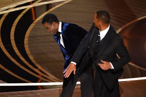 While Chris Rock was cracking jokes on stage about Smith's wife, Smith went up and slapped Rock.